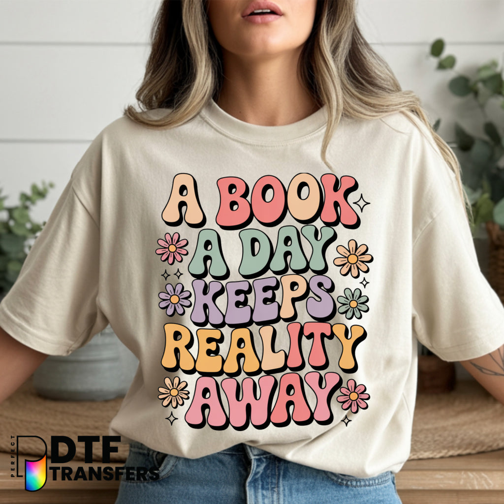 A Book A Day Keeps Reality Away – Teacher Reading DTF Transfer